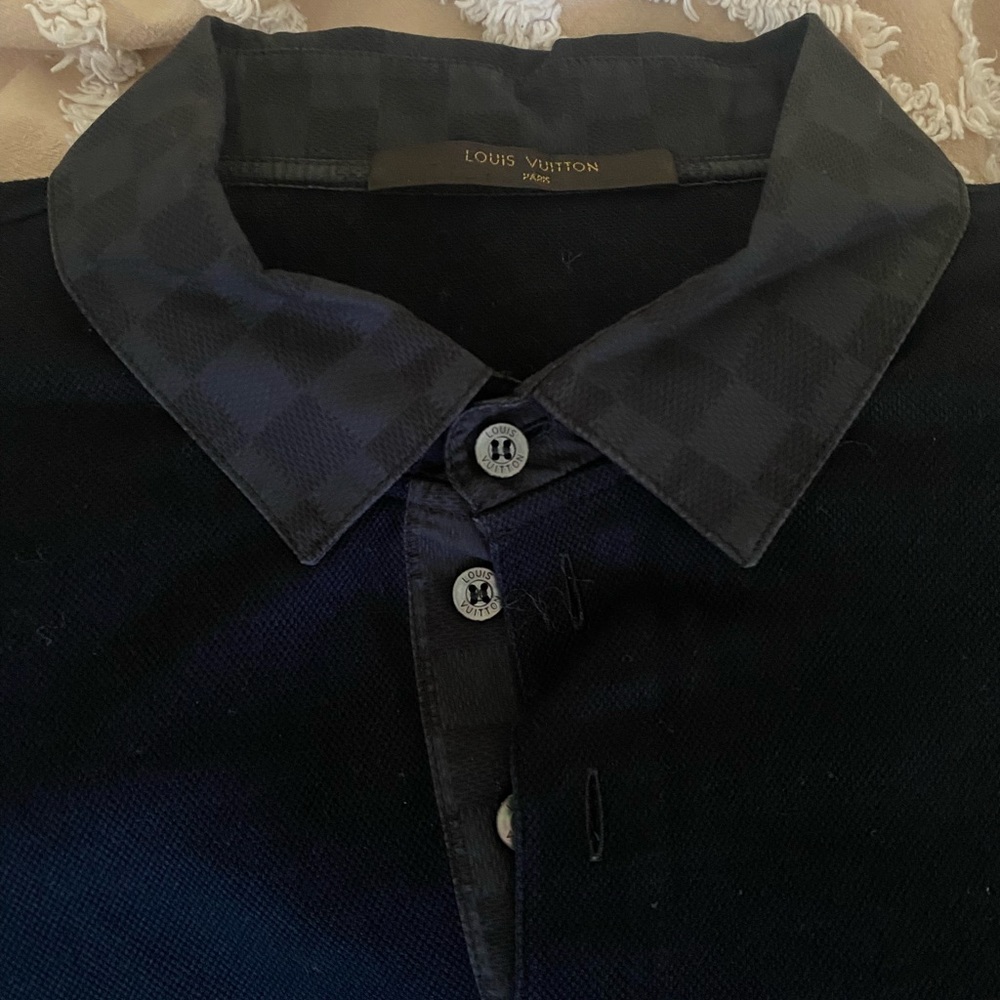 Men’s authentic Louis Vuitton black polo. European large, fits like a medium.